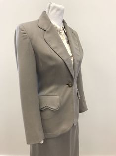 "I love suits from this era because they have such great vintage details. The silhouette and fabric from the late 1940s/early 1950s are are fantastic. The gorgeous scalloped double layer pocket flaps are my favorite detail but the tan dome buttons connected by a silver chain for the closure is a close second. The collar and lapel as well as jacket hem are curved and accented with pick stitching along the edges as well as on the double pocket flaps. Bound buttonholes. The skirt has inverted darts Vintage Fitted Skirt Suit With Notch Lapel, Vintage Skirt Suit With Buttons For Office, Vintage Office Skirt Suit With Buttons, Classic Fitted Skirt Suit With Pockets, Vintage Fitted Skirt Suit For Formal Occasions, Vintage Notch Lapel Skirt Suit For Work, Vintage Notch Lapel Skirt Suit For Office, Vintage Formal Lined Skirt Suit, Vintage Lined Skirt Suit For Formal Occasions