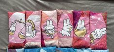 four pairs of socks with cartoon characters on them