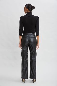 Luxe Vegan Leather lends a chic expression to the season's must have Cargo Pant. The relaxed fit, pintuck details & cargo pockets are the definition of sporty cool. Get ready for the compliments. Elie Tahari Exclusive Vegan Leather Cargo Pants 50% Polyester, 50% Polyurethane Relaxed Fit; Runs true to size. Model is 5'9" and wearing size 2 Measurements: Front Rise: 11"L , Inseam: 32.75"L (approx. length for size 6) Dry clean Imported Style #: E90AM214 Leather Cargo Pants, Jumpsuit Jacket, Long Sleeve Short Dress, Elie Tahari, Cargo Pant, Cashmere Wool, Knit Tees, Denim Coat, Knit Jacket