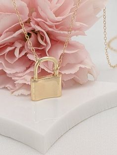 Our gift to you 10% off your first purchase. Details here - http:/eepurl.com/dpVPBzOur love lock necklaces are perfect stand alone or layering pieces. Locks are suspended on our signature gold fill chain.Lots of love and symbolism in these pieces. They make thoughtful gifts or that something special for yourself!....................DETAILS14 k fill chain and components18 k gold fill charm high shine finishThis listing is for one tiny lock necklace onlyCharm is approximately 1/2"wide by 3/4" high Minimalist Everyday Jewelry With Lock Detail, Elegant Everyday Necklaces With Lock Detail, Elegant Lock Necklace For Gift, Elegant Necklace With Lock Detail As Gift, Elegant Necklace With Lock Detail For Gift, Minimalist Lock Jewelry For Gifts, Minimalist Jewelry With Lock As A Gift, Minimalist Lock Jewelry As A Gift, Minimalist Lock Jewelry As Gift