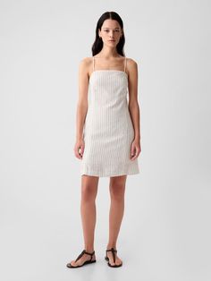 Soft linen-blend mini dress.  Square neck.  Spaghetti straps.  Zipper at back.  Fit: Slim.  A slim silhouette that fits close to the body.  Hits above the knee.  Models wearing Gap