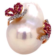 18K White Gold Pearl: 3.87grm total weight Pink Sapphire: 0.37ct total weight Diamond: 0.13ct total weight. All diamonds are G-H/SI stones.