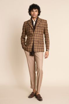 Brown checkered pattern three buttoned single breasted blazer with flap patch pockets.
Components: 1
Neckline: Notched Lapel
Sleeve Type: Full
Fabric: 100% Wool Tweed Checks
Color: Brown
Other Details: 
Horn buttons detailing
 Note: The inner shirt, scarf, pant and the bag carried by the model are not for sale
Occasion: Party - Aza Fashions Tailored Plaid Blazer With Patch Pockets, Tailored Plaid Suit With Pockets, Semi-formal Plaid Sport Coat With Welt Pockets, Tailored Plaid Tweed Jacket With Patch Pockets, Plaid Tweed Jacket With Welt Pockets And Notch Lapel, Plaid Wool Blazer With Patch Pockets, Plaid Blazer With Lapel Collar And Welt Pockets, Plaid Blazer With Welt Pockets And Lapel Collar, Plaid Tweed Jacket With Notch Lapel And Welt Pockets