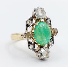 French antique marquise ring 18k gold set with a 2.24 carat emerald cabochon surrounded by table and rose cut diamonds (circa 1900)  Magnificent and rare work of an antique goldsmith  Size: 52 FR / 6 US  Weight: 6.20 g  Emerald size: approximately 10 x 7.5 x 4 mm (estimated at 2.24 carats) Table cut diamond size: approximately 4.5 x 4 mm  Head size: 22 x 15 mm  ATTENTION: table cut diamonds have chips, the emerald cabochon have small surface scratches Owl punches (French punches) Visit my shop f Heirloom Oval Emerald Ring With Rose Cut Diamonds, Vintage Green Emerald Ring With Rose Cut Diamonds, Vintage Oval Emerald Ring With Rose Cut Diamonds, Vintage Green Marquise Emerald Ring, Victorian Emerald Ring With Rose Cut Diamonds, Victorian Green Emerald Ring With Rose Cut Diamonds, Antique Cabochon Emerald Wedding Ring, Antique Oval Cabochon Emerald Ring, Victorian Emerald Ring With Rose Cut Diamonds For Wedding