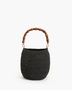 A woven basket bag inspired by a honeypot. Clare V. is based in LA and this bag was handwoven in The Philippines and finished in LA. – 5.5 inches wide and 8 inches tall with a 13.25 inch detachable handle – Unlined – Images via Clare V. Handwoven Bag, Clare Vivier, Clare V, Clare V., Bamboo Handles, Basket Bag, Hey Girl, Chic Accessories, Accessories Branding