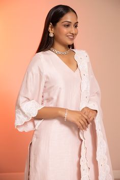 Blush cotton silk straight kurta with sequins and cutdana applique embroidered hem and cuffs. Comes with pant and a dupatta.
Components: 3
Pattern: Applique embroidered
Type Of Work: Sequins, Cutdana
Neckline: V Neck
Sleeve Type: Three quarter
Fabric: Cotton silk
Color: Pink
Other Details: 
Embroidered borders on dupatta
Attached lining
Note : Kindly contact customer service for customizations in dupatta.
Occasion: Mehendi and Haldi - Aza Fashions Elegant Cotton Palazzo Set For Diwali, Elegant Cotton Sharara With Straight Kurta, Elegant Cotton Palazzo Set With Zari Work, Elegant Pant Set With Chikankari Embroidery For Diwali, Elegant Cotton Sharara, Elegant Chanderi Pant Set With Chikankari Embroidery, Elegant Cotton Sharara For Designer Wear, Elegant Cotton Sharara For Diwali, Elegant Cotton Sharara With Chikankari Embroidery