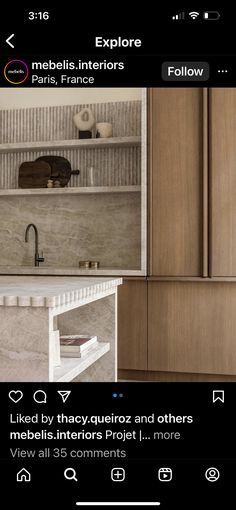 an image of a kitchen with marble countertops and wooden cupboards on instagram