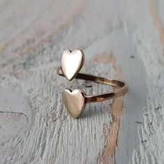 There are many single heart rings, but the heart wants to be close to another, so I fashioned this delicate and unique ring to keep two hearts together.  It has been handcrafted from solid sterling silver and can be self adjusted from a size 4 to a size 9.**Need more than one? or have a question? Please convo me to assist!**All pieces come in a customized Gwen Delicious Gift Box. Two Hearts Together, Wax Seal Ring, Oak Leaf Necklace, Mother Necklace Personalized, Double Heart Ring, Silhouette Necklace, Double Rings, Heart Rings, Acorn Necklace