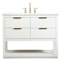 a white bathroom vanity with two sinks and gold faucets