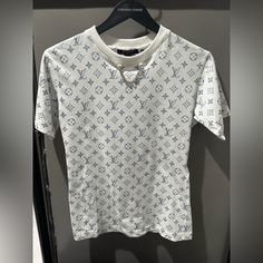 Brand New Without Tag, Comes With Receipt For Authentication. (Poshmark Will Also Authenticate It) Size Xs, Got It Tailored At The Louis Vuitton Store To Fix Like A Xs Otherwise It Was Too Oversized. Purchased On 11/30/21, Took Tag Off But Never Wore It. Currently Retails For $1010 Summer Monogram Print Tops, White Monogram Print Short Sleeve Top, White Monogram Print Top With Short Sleeves, Luxury White Top With Monogram Print, Luxury White Short Sleeve Top, Luxury White Summer Tops, Luxury White Tops For Summer, Louis Vuitton Sweater, Louis Vuitton Top