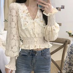 Lace button up shirt with long puff sleeves and a floral peter pan collar lined with pearl beads. Cinched waist and cuffs. Loop button closure. S: 13.5" across shoulders, 37" chest, 17" length M: 14" across shoulders, 38.5" chest, 17" length L: 14.5" across shoulders, 40" chest, 17.5" length XL: 15" across shoulders, 41.5" chest, 17.5" length Lace Button Up Shirt, Pan Collar Blouse, Peter Pan Collar Blouse, Lace Button, Long Puff Sleeves, Collar Blouse, Pan Collar, Peter Pan Collar, Cinched Waist