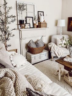 a living room filled with furniture and a fire place next to a white fireplace mantel