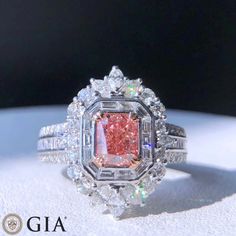 Bienvenue chez Odyssée Joaillerie, nous nous spécialisons dans le diamant coloré,  et les bagues de fiançailles. Nous offrons un grand choix: blanc, ou jaune, ou rose, platine,  nos bijoux sont finement fabriqués pour une qualité exceptionnelle! Symbole d'amour par excellence, le diamant est une belle preuve d'amour. Le joyau de vos rêves est le vôtre! Détails : Marque: Odyssée Joaillerie Métal : or blanc et rose 18k  * Pierre centrale : Diamant Fancy Pink-Brown 1,01ct I1 * Pierres latérales: Di Luxury Pink Diamond Ring For Formal Occasions, Classic Pink Gia Certified Diamond Ring, Pink Gia Certified Diamond Ring For Formal Occasions, Formal Pink Gia Certified Diamond Ring, Pink Diamond Cut Diamond Ring, Elegant Pink Gia Certified Diamond Ring, Elegant Gia Certified Pink Diamond Ring, Luxury Pink Gia Certified Diamond Ring, Elegant Pink Moissanite Diamond Ring