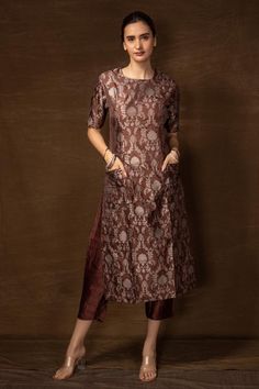 Brown banarasi silk kurta with floral pattern and side pockets. Comes with pant.
Components: 2
Type Of Work: Floral
Neckline: Round
Sleeve Type: Half
Fabric: Banarasi silk
Color: Brown
Other Details: 
Side slits on kurta
Occasion: Sangeet - Aza Fashions Round Neck Embroidery Designs For Kurtis, Satin Kurta, Anarkali Tops, Diwali Ideas, Honey Suckle, Banarasi Suit, Long Gown Design, Silk Suits, Kurti Patterns