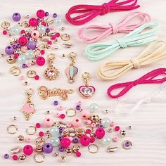 EASY TO MAKE, FUN TO WEAR: Making stylish Juicy Couture bracelets is simple with this DIY girls jewelry making kit! It has everything girls will need to make up to 5 dazzling bracelets, including cute Juicy Couture charms, various beads & plenty of cord & thread KEEP IT ORGANIZED: Girls can keep all of their jewelry making supplies tidy and organized with the included play tray! Pack up the beads and charms when playtime is over for easy cleanup & storage! HELPS KIDS DEVELOP REAL WORLD SKILLS: Creating their own beautiful jewelry helps young girls develop fine-motor, visual, and tactile-sensory skills - all while having fun and expressing themselves! PERFECT FOR AGES 8+: Make It Real's developmental toys make great gifts for girls and tweens, helping them to develop skills that will allow Cute Pink Craft Supplies With Round Beads, Cute Pink Round Beads Craft Supplies, Pink Cute Round Beads Craft Supplies, Pink Handmade Craft Supplies For Party Favors, Handmade Pink Craft Supplies For Party Favors, Playful Pink Craft Supplies For Gift Making, Playful Pink Craft Supplies For Crafting, Playful Pink Craft Supplies, Charm Bracelet Making