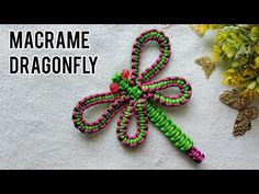 the macrame dragonfly is made out of beads