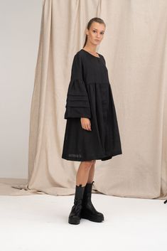 Flowy and romantic, the black linen summer dress provides you with the comfort of wearing natural fabrics. Made of 100% soft linen, the more you wear the linen shirt dress, the softer it becomes.  Our plus size linen dress features an oversized relaxed fit and long sleeves with decorative pleats. The black linen midi dress has an a-line silhouette, a crew neckline and hidden front button closure. This black boho linen dress is designed to flatter every body type. When we designed this black line Black Linen Dress Relaxed Fit For Summer, Black Relaxed Fit Linen Dress For Summer, Black Linen Long Sleeve Dress For Spring, Black Long Sleeve Linen Dress For Spring, Black Bohemian Linen Dress For Summer, Black Bohemian Linen Summer Dress, Black Bell Sleeve Dress For Summer, Black Bell Sleeve Summer Dress, Spring Black Linen Midi Dress