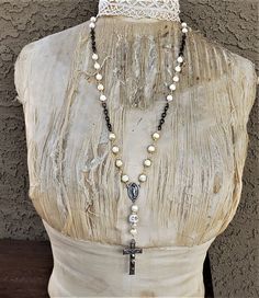 I used composite beads and a composite skull as the base for this necklace.  I created rosary chain with the beads separated by solid brass chain.  Vintage rosary pieces are incorporated.  I added rhinestones and a rhinestone rondels to the skull.  Definitely goth with a mix of steampunk.  It hangs approximately 30 inches.  You may choose a variation on the length if you desire. Goth Rosary, Green Brooch, Hand Painted Pendant, Goth Necklace, Assemblage Necklace, Steampunk Necklace, Goth Jewelry, Rosary Necklace, Steampunk Jewelry