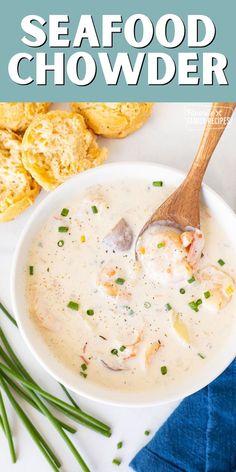 a white bowl filled with seafood chowder on top of a blue and white napkin