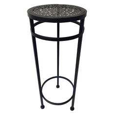 an iron side table with a circular design