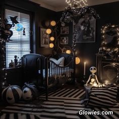 a black and white striped rug in a baby's room decorated with halloween decorations