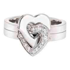 This is part of Chairish’s Fine Jewelry assortment.  Pre-owned Cartier double heart diamond ring crafted in 18k white gold (circa early 2000s).    Diamonds total an estimated 0.15 carats (estimated at G-H color and VS1-2 clarity).   The sweet double heart design is set with diamonds to one of the hearts. The ring is a smaller size (EU 47 or US 4) and is great worn on the pinky finger. Dating to the early 2000s the ring is an out of production Cartier design. The ring does not come with Cartier p Luxury Heart Shaped Diamond Ring For Formal Occasions, Formal Heart-shaped Diamond Ring With Single Diamond, Luxury Heart Ring With Single Cut Diamonds For Wedding, Formal Heart Shaped Cubic Zirconia Diamond Ring, Formal Heart Ring With Brilliant Cut, Luxury Single Diamond Heart Cut Ring, Luxury Heart-shaped Brilliant Cut Diamond Ring, Formal Single Diamond Heart-cut Ring, White Gold Heart Ring With Single Diamond