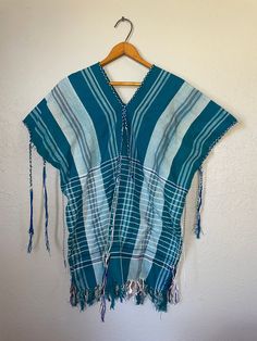 "Good Condition! Has flaws  measurements:  46\" bust, 27\" length" Bohemian Cotton Tops One Size, Folk Style Tunic Tops For Beach, Traditional Summer Poncho For Festivals, Traditional Summer Beach Poncho, Short Sleeve Cotton Poncho For Summer, Cotton Short Sleeve Summer Poncho, Blue Cotton Summer Poncho, Bohemian Short Sleeve Poncho For Spring, Bohemian Short Sleeve Poncho For Beach