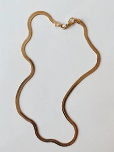 The Gold Herringbone Necklace from Océanne is a timeless and beautiful addition to any jewelry collection. With its 24K gold-plated or gold-filled herringbone pattern, the necklace is perfect for any occasion, whether you're dressing up for a night out or just keeping it casual. Layer it with your other favorite pieces or wear it solo to add a touch of subtle elegance to your ensemble. No matter how you choose to style it, the Herringbone Necklace is sure to become a wardrobe staple. Additional Minimalist 14k Gold Double Chain Necklace, Minimalist Gold-tone Chain Necklace For Everyday, Everyday Minimalist Gold-tone Chain Necklace, Minimalist Gold Herringbone Necklace For Everyday, Gold Minimalist Herringbone Necklace For Everyday, Gold Dainty Herringbone Necklace For Everyday, Gold Herringbone Necklace With Adjustable Chain For Everyday, Minimalist Gold-tone Snake Chain Necklace, Dainty Gold Chain Herringbone Necklace For Everyday