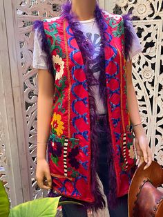 This vintage embroidered vest is so gorgeous! Perfect for concerts, festivals, or a night out! Embroidered silk. Fully lined, pockets and purple Mongolian fur trim. Best fits M to L. Purple Afghan, Mongolian Fur, Embroidered Vest, Vest Outfits, Embroidered Silk, Fur Trim, Favorite Things Gift, Womens Vest, Labour Day