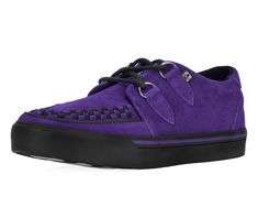 Normal is boring! Get ready to hit the stage or the streets in these vulcanized sneakers that reimagines our former creeper sneaker silhouette with bold & modern twists. Features one of our crowd-pleasing upper styles of purple cow suede with classic D-rings & iconic interlace detailing along the front. The VLK collection features a more streamlined and sleeker look compared to our past creeper sneaker designs. In addition to its' updated form, the vulcanized sneakers have removable insoles with a 3mm layer of memory foam and a lightly padded tongue for added comfort. VLK brings to you everyday wearability with a clean style while incorporating the edge & originality that T.U.K. is known for. Purple Low-top Skate Shoes With Vulcanized Sole, Casual Purple Non-slip Sneakers, Purple Low-top Sneakers With Rubber Sole, Purple Suede Lace-up Sneakers, Purple Non-slip Synthetic Sneakers, Normal Is Boring, Purple Cow, Purple Suede, Suede Sneakers