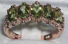 "*This ring is made from 585 14K (14ct 14Kt) Rose Gold with Genuine Natural Peridots. This is a beautiful Antique Style 14K Rose Gold ring set with five 6x4mm (0.24\"x0.16\" inches) vibrant natural Peridot gemstones in a stunning solid 14K Yellow Gold setting with carving on the shoulders.  This ring is handcrafted from Solid English 14K Gold and tested and fully Hallmarked by the London Assay Office.   All the Gemstones are Genuine Natural Gemstones, hand-selected for color and clarity. If you have any specific gemstone requirements then please do convo me. PLEASE MAKE SURE YOU STATE THE FINGER SIZE YOU REQUIRE WITH YOUR PAYMENT AND ALSO INCLUDE YOUR TELEPHONE NUMBER FOR DELIVERY COURRIER. < CUSTOMIZATION > This ring can be customized to your requirements  - 9K, 14K, or 18K Yellow, Rose o Peridot Engagement Rings, Rose Gold Ring Set, Ring Rosegold, Victorian Rings, 14k Rose Gold Ring, Eternity Band Ring, Gold Ring Sets, Yellow Gold Setting, Peridot Gemstone