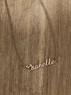 Our name necklace is classic in style and bold in design. #goldnecklace #christmasgift #chainnecklace #cutenecklace #jewelry Vintage Custom Name Necklace For Gift, Handmade Adjustable Nameplate Necklaces, Handmade Adjustable Nameplate Necklace, Handmade Rose Gold Name Necklace For Personalized Gift, Handmade Rose Gold Name Necklace As Personalized Gift, Handmade Rose Gold Name Necklace For Mother's Day, Handmade Nameplate Necklace For Birthday, Thoughtful Gifts For Boyfriend, Gifts For Boyfriend Parents