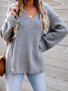 Grey Oversized Soft Knit V-neck Sweater, Gray V-neck Sweater For Loungewear, Gray V-neck Sweater For Fall Layering, Gray Soft Knit V-neck Sweater, Cozy Soft Knit Gray Sweater, Oversized Gray Sweater For Everyday, Gray Oversized Cozy Sweater, Gray Textured Knit V-neck Sweater, Comfortable Gray Long Sleeve Sweater