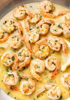 a pan filled with shrimp and lemon sauce