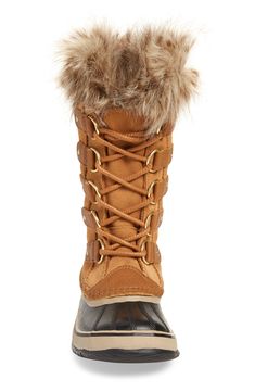 A warm, waterproof boot is designed with cozy faux-fur trim and features a lace-up panel that adjusts for a perfect fit. Comfort rated to -25 degrees Fahrenheit, it's built to keep your feet feeling warm and toasty when temperatures take a nose dive. 1 1/4" heel; 3/4" platform (size 8.5) 12" shaft; 16"–21" calf circumference Lace-up style Removable insole Seam-sealed waterproof construction Leather and synthetic upper/textile faux-fur trim/rubber sole Imported Women's Shoes Sorel Joan Of Arctic, Sorel Joan, Waterproof Snow Boots, Snow Boot, Snow Boots Women, Sorel Winter Boot, Waterproof Boots, Fur Trim, Up Styles