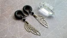 These beauties are handcrafted gauges made out of polymer clay shown in 0g Black w/Gold Glitter. These are made to order in your size and color. These are adorned with stainless steel dragonfly wing charms / Bronze metal accent charms / faceted onyx stone beads. Check out my other gauged earrings http://www.etsy.com/shop/TheCreatorsCreations These are made to order These earrings are a work of art, each set is unique. ....... Follow The Creator's Creations for latest designs & coupons! Shop- www Dragonfly Wings, Plug Earrings, Gauged Earrings, Plugs Earrings, Bronze Metal, Onyx Stone, Mixed Metals, Metallic Accents, Stone Earrings