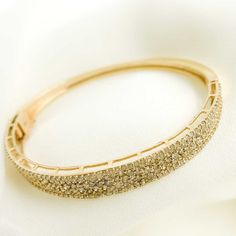 14K Solid Gold Diamonds Bangle HIGH QUALITY BANGLE This modern and on-trend design is crafted from genuine 14k solid gold Circumference: 19cm (7.4 inches) Thickness:4mm. Size:8mm Length: 63mm. Width:56mm Metal: 14k Solid Gold Purity: 14K (Stamped for Authenticity)  Processing time: 1-2 business days FAST SHIPPING Gold Jewelry Store NY sells only authentic solid 14K Gold. We do not sell gold plated or gold-filled jewelry. This is a delicate bangle made with Solid 14K Gold. It requires extra care Fine Jewelry Yellow Gold Bangle For Party, Gold Diamond Bracelet For Anniversary With Elegant Design, Yellow Gold Bangle For Party, Gold Diamond Bracelet With Elegant Design For Anniversary, Yellow Gold Bangle Jewelry For Party, Modern Gold Bangle Diamond Bracelet, Modern Gold Diamond Bracelet For Wedding, Dazzling Gold Bangle Bracelet For Formal Occasions, Dazzling Yellow Gold Bracelet For Gift