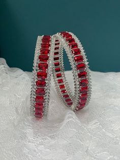 American diamond bangle/bracelet in Silver . About one inch wide. Colored stone work Ruby Bangles, Diamond Bangle Bracelet, Bracelet In Silver, Diamond Bangles Bracelet, Colored Stone, Diamond Bangle, Jewelry Design Necklace, Stone Work, American Diamond