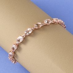 This Marropino morganite tennis bracelet is beautifully crafted to suit your fashion needs. Made from sterling silver, the morganite bracelet is studded with Marropino morganite ovals set securely in the prong setting. Rose gold vermeil on its durable sterling silver frame intensifies the rosy hues of this bracelet and makes it look more luxurious. Morganite is one of the strongest heart stones that you can get your hands on. This special Beryl variety offers up pure love and compassionate energ Morganite Bracelet, Morganite Jewelry, Wedding Jewelry Bracelets, Wedding Bracelet, Silver Frame, Gold Plated Silver, Tennis Bracelet, Morganite, Chain Link Bracelet