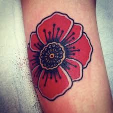 a red flower tattoo on the arm