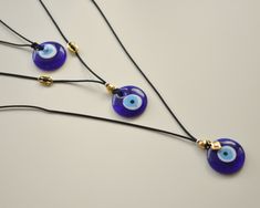 Blue glass evil eye necklace, Made in Greece, Protection jewelry for women, Good luck gift ----------Size and Material:--------------- Evil eye size: 30mm Length of necklace: 90cm (total cord) with macrame closure for adjustable length. Material of evil eye : glass You can choose one of three styles one single and two others with gold details. Stay Elegant with this protection simple jewelry. This necklace is the perfect solution for everyday look. Υou can combine it with other jewelry from our Black Spiritual Necklace With Evil Eye Detail, Black Spiritual Necklace With Evil Eye, Black Evil Eye Spiritual Necklace, Spiritual Black Evil Eye Necklace, Glass Evil Eye, Protection Jewelry, Spring Bracelet, Good Luck Gifts, Eye Glass