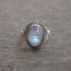 Gemstone - Natural Rainbow Moonstone Gemstone Size - 12x16 mm oval Metal - Sterling Silver natural AAA rainbow moonstone set with a sterling silver handmade ring Each Ring made with Precision and love, these rings are perfect for everyday use and a perfect accessory to wear at work. Rings can be customized on request and gemstone can be switched to any other as per requirement. Other beautiful designs uploaded with fabulous gemstones. kindly visit my store to view the complete collection. Feel f Mystical Oval Cabochon Jewelry, Mystical Oval Cabochon Rings, Mystical Oval Moonstone Ring Gift, Mystical Oval Crystal Ring As Gift, Dainty Handmade Oval Opal Ring, Oval Moonstone Gemstone Jewelry, Silver Moonstone Ring With Natural Stones For Wedding, Spiritual Oval Moonstone Ring With Natural Stones, White Oval Moonstone Ring Gift