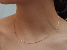 ** Thin Snake Chain Necklace ** 14K Gold Plated over Sterling Silver or Gold Filled ** Gift box available - Comfortably lightweight and layerable, this thin gold snake chain necklace can stand on it's own or in a layered set. - 16'' long necklace with spring clasp ( 14K gold plated) or 17'' long necklace ( gold filled) - Made of 14K gold plated sterling silver or gold filled- This necklace also comes in with a very nice gift box and a nice pouch Simple Chains Gold, Gold Simple Chain, Plain Gold Necklace, Box Chain Gold, Gold Snake Necklace, Small Gold Chain, Simple Gold Chain, Simple Chain Necklace, Gold Snake Chain