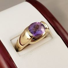 "\"Previously Loved, Not New\" Vintage Amethyst Ring, Featuring a Genuine Amethyst center (*Price of the ring is really gold only. The center is pretty scratched on the surface.*) This Genuine Purple Amethyst center stone is a checkered board cut oval shape. 14k Yellow Gold setting with 2 heavy bars. **Ring size: 6.25 **Amethyst is February's Birthstone, AND 2018 color of the year. This item can be sized up or down 2 sizes for an additional $30.00 Please feel free to contact me anytime, if you h Classic Amethyst Ring With Round Cut, Formal 14k Stamped Amethyst Ring, 14k Yellow Gold Amethyst Ring With Accent Stones, Classic Amethyst Purple Rings, Purple Amethyst Hallmarked Signet Ring, Classic Purple Gemstone Signet Ring, Fine Jewelry Amethyst Ring In Yellow Gold, Amethyst Yellow Gold Rings Fine Jewelry, Classic Purple Amethyst Ring With Round Cut