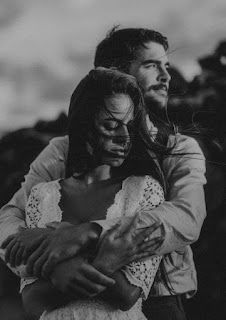 black and white photo of couple embracing each other