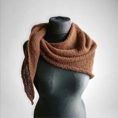 This brown alpaca scarf might be a good Mother's day gifts idea. This woolen winter scarf is warm, soft and silky. A triangle shawl in earth tones for ladies who value minimalist design.  100% natural alpaca.  Gently hand wash in cold / cool water, lay flat to dry.  Dimensions when flat appr: 90 cm x 146 cm x 90 cm (35 inches x 57 inches x 35 inches) central line length - 60 cm (23 inches) I ship with registered priority mail from Kaunas, Lithuania. If you are in Europe, the transit time is 7-10 Brown Alpaca Shawl For Fall, Hand Knitted Shawl Wrap For Fall, One Size Alpaca Scarves For Fall, Alpaca Brown Shawl For Winter, Brown Alpaca Shawl For Winter, Brown Knitted One-size Shawl, Brown Shawl Wrap One Size, Winter Shawl One Size - Perfect Gift, One-size Winter Shawl Perfect For Gifts