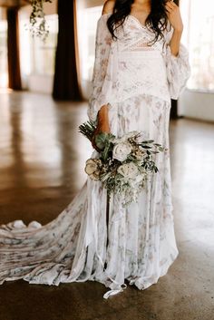 a woman in a white dress holding a bouquet