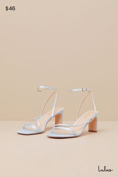 Keep things chic and simple by adding the Lulus Kierha Baby Blue Satin Strappy Low Heel Sandals to any of your effortlessly elegant 'fits! Sleek woven satin shapes these darling heels that feature a square footbed, two slender two straps, and an asymmetrical vamp strap. Matching straps sprout from the sides to cross at the front of the ankle and secure with a gold buckle, all atop a trendy blade heel. 2. 75" wrapped blade heel. Cushioned insole. Felted rubber sole has nonskid markings. Man made Blue Bridal Shoes Low Heel, Dusty Blue Heels Wedding, Spring Prom Heels With Padded Heel, Low Heel Satin Sandals For Spring, Padded Heel Sandals For Prom In Spring, Summer Prom Heels With Padded Heel, Chic Sandals With Padded Heel For Prom, Satin Sandals With Heel Strap And Open Heel, Low Heel Satin Heels With Wrapped Heel