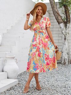 Make a statement with the Gemma Floral Midi Dress. Featuring a vibrant tropical print, this dress is perfect for adding a playful touch to any outfit. With a flattering midi length, it's sure to turn heads and keep you feeling confident all day long. Say aloha to your new go-to vacation dress! Size Guide: Tina is 5’65” tall, and has a 33.6” bust, 24.1” waist, & 35.2” hips. She is wearing a S / US 4 / AU 8. This dress is true to size. Material: 100% Polyester. Feature: V-neckline. Midi length. Sh Dresses Casual Boho, Wardrobe Styling, Short Sleeve Midi Dress, Short Summer Dresses, Mini Robes, Belted Midi Dress, Floral Print Midi Dress, Weave Style, Midi Short Sleeve Dress