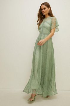 Style: Maxi DressLength: MaxiNeckline: CrewSleeve Length: Short Sleeve Short Bridesmaid Dresses With Sleeves, Subtle Floral Bridesmaid Dresses, Garden Party Bridesmaid Dress Green, Sage Green Dress Formal Modest, Light Green Dress With Sleeves, Sage Green Boho Bridesmaid Dresses, Sage Green Lace Bridesmaid Dresses, Green Boho Bridesmaid Dress, Mint Maxi Dress